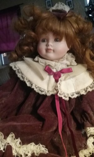 Value of a Samantha Porcelain Doll -
red haired doll in velvet and lace dress