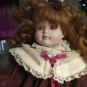 Value of a Samantha Porcelain Doll -
red haired doll in velvet and lace dress