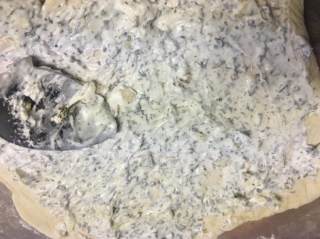 spreading Garlic and Herb filling