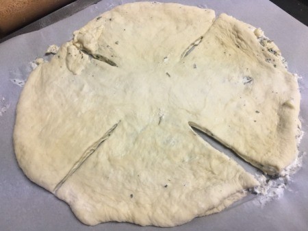 cutting doubled dough with 4 slits
