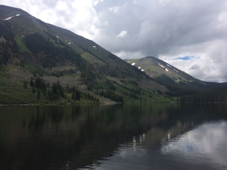 A lake beside a mountain in Taylor Park, CO.