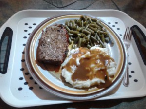 meatloaf, mashed potatoes, green beans on plate