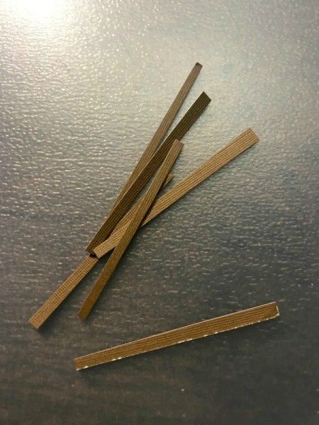 Bottle Cap Ornaments  - thin strips of brown paper