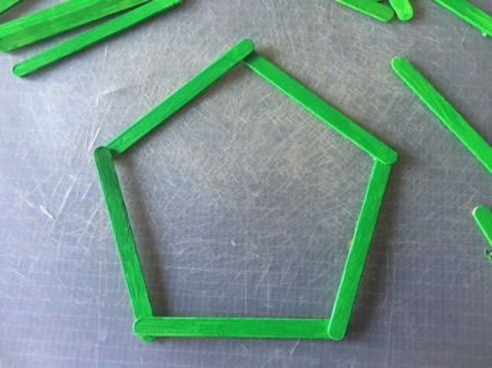 Popsicle Stick Wreath - arrange 5 sticks into a pentagon shape and glue