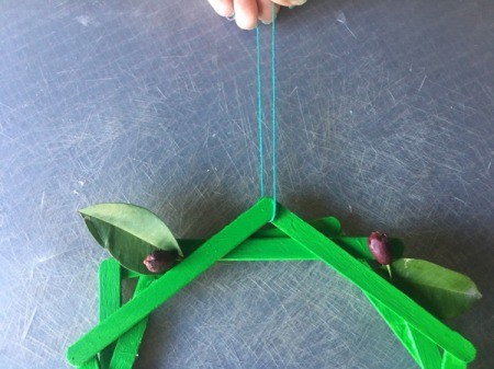 Popsicle Stick Wreath - tie a string for hanging through the top of the pentagon