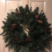 A Christmas wreath on a door.