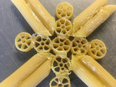 Pasta Christmas Ornaments - glue penne arrow shapes in-between the bars of the cross shape
