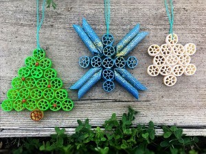 Pasta Christmas Ornaments - ornaments against a wood background