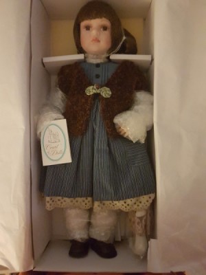 Value of Porcelain Jenny Doll - doll wearing blue dress and vest