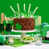 Shamrock cake surrounded by St. Patrick's Day decorations