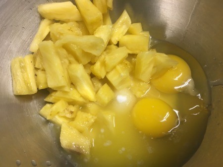 Baked Pineapple, egg and sugar to mix in bowl