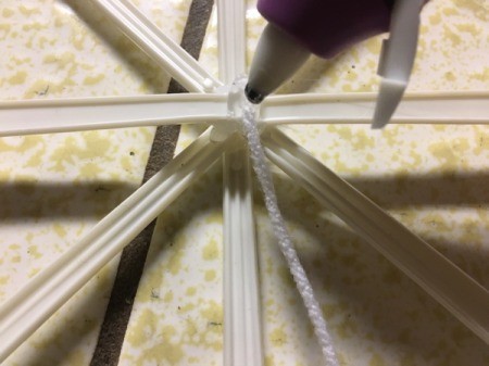 Stick and Yarn Snowflake Decoration - glue a long piece of yard to the back