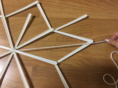Stick and Yarn Snowflake
Decoration - pull yard to tips of stick and secure by wrapping around