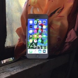 A smartphone against a window.