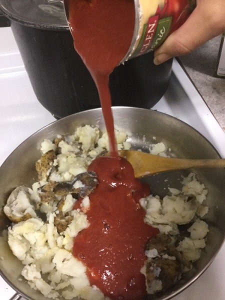adding tomato sauce