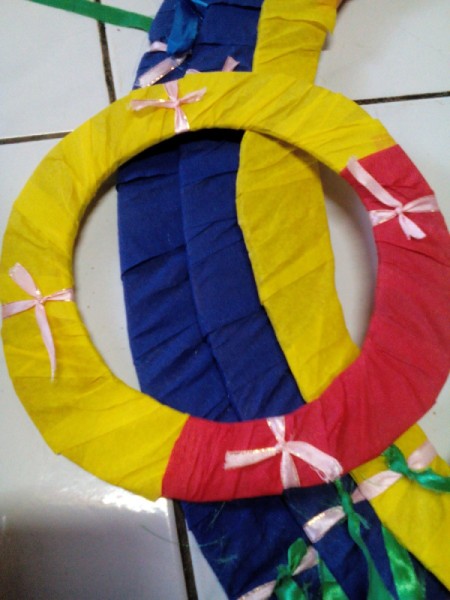 DIY Hanging Cardboard Christmas Tree - tie 4 ribbons onto each ring, evenly spaced