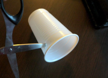 Hot Air Balloon Decoration - using hole punch or scissors make two holes in the cup on opposite sides