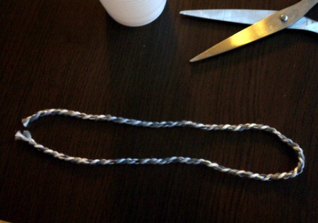 Hot Air Balloon Decoration - fold the other two pieces of string in half but do not ite