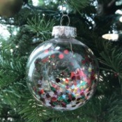 Clear Ornaments with Christmas Confetti  - ornament hanging on the tree