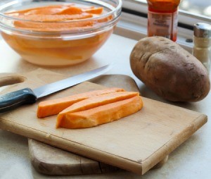 Sweet Potatoes on a cutting board.