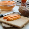 Sweet Potatoes on a cutting board.