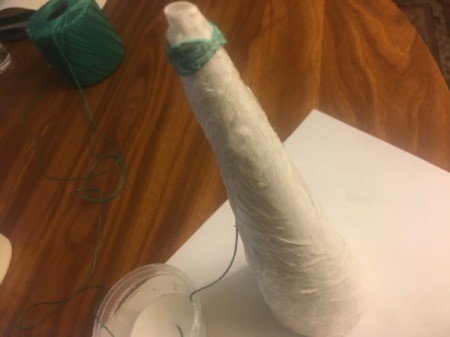 Mini String Christmas Tree - begin wrapping the string around the cone, with the end tucked in