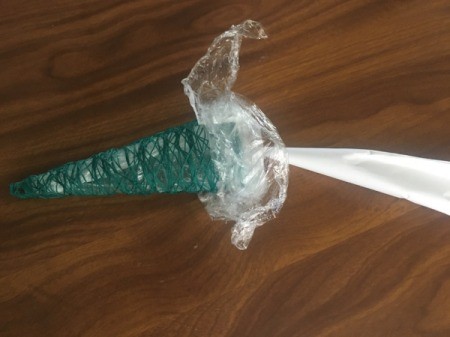 Mini String Christmas Tree - untuck the plastic wrap and remove the cone