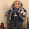 Identifying a Porcelain Doll - doll wearing a hoodie and overalls