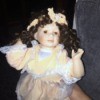 Value of Porcelain Dolls - doll with dark ringlets