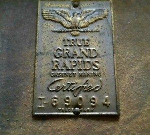 A certification plaque for True Grand Rapids Imperial Furniture.