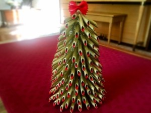 Pasta Christmas Tree - finished pasta tree on a red surface