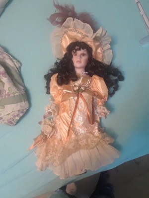 Identifying a Porcelain Doll - dark haired doll with apricot long dress