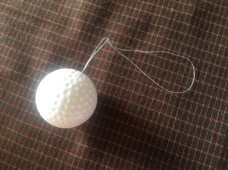 Cupcake Liner Ornament - stick both ends of string into the hole
