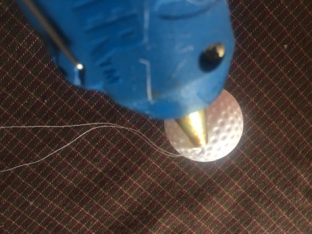 Cupcake Liner Ornament - hot glue the hole shut