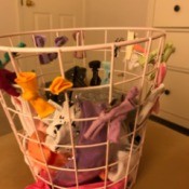 Using a wire waste basket to clip hair bows and accessories for organizing.