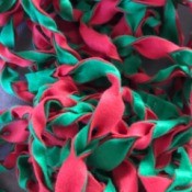Easy Christmas Felt Garland or Bracelet - pile of garland before wrapping on stair railing