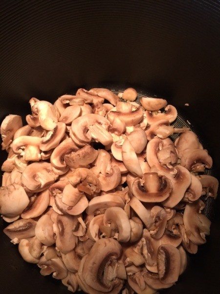 sliced mushrooms in pan