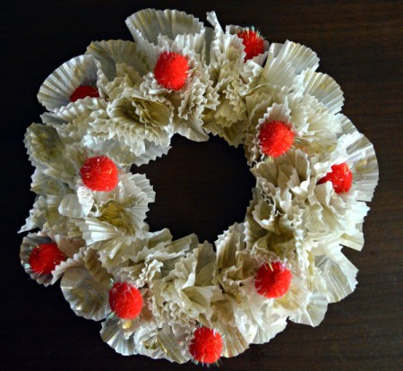 Christmas Eve Pillar Candle Decoration - hot glue glitter pom poms to wreath