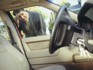 Man Looking at His Keys Locked In the Car