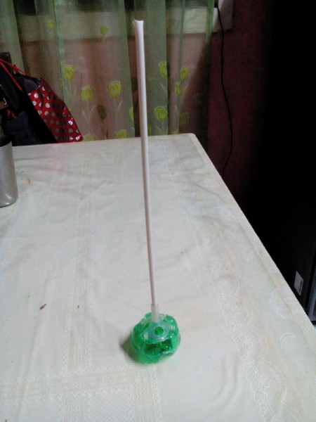 Plastic Bottle Christmas Tree - glue a balloon stick or dowel in the center of the stand
