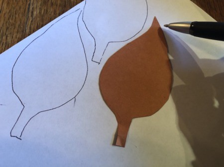 Making a Duct Tape Poinsettia - trace leaves onto a piece of paper and the on a second one