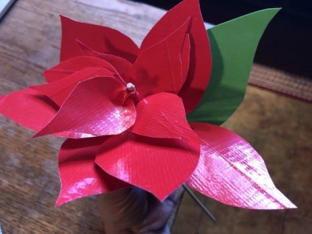 Making a Duct Tape Poinsettia - start taping the green leaves underneath
