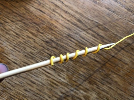 Making a Duct Tape Poinsettia - wrap wire around the bottom of the stick to make a springy spiral