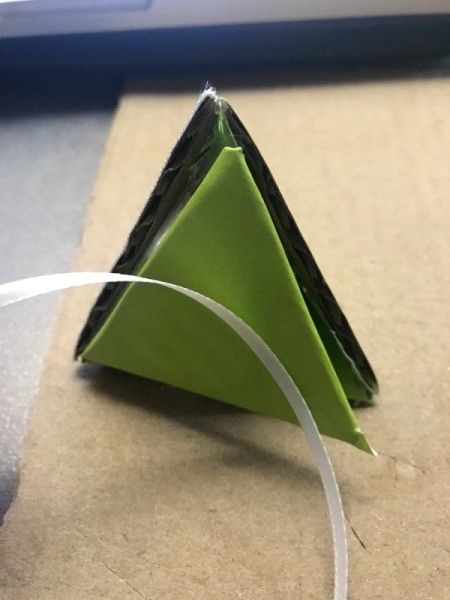 Christmas Triangle Candy Box Ornament - bottom of box and a piece of narrow ribbon