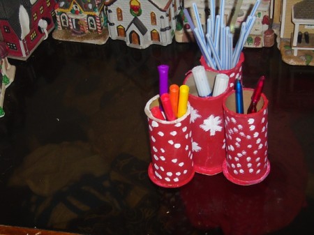 Using old decorated ribbon rolls as a pen holder