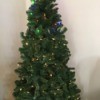 Setting Light Colors on a Pre-lit Christmas Tree - top lights colored an bottom are white