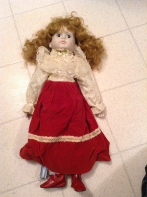 Identifying a Porcelain Doll - doll with fancy blouse, long red skirt, and red shoes