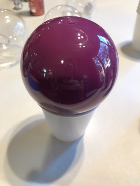 Poured Paint Ornaments  - purple ball sitting top down in a cup