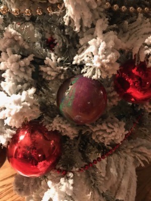 Poured Paint Ornaments - multicolored ball hanging on flocked tree