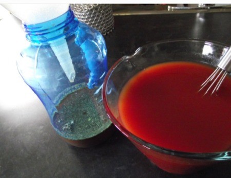 mixing tomato paste and jar with funnel